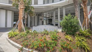 A building entrance with a sign reading "SEA CLASS 903".