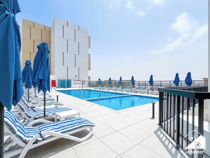 Outdoor pool - Stylish RAK Studio Balcony, Pool & Fitness (Dubai)