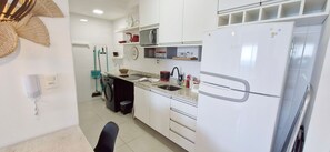 Fridge, microwave, coffee/tea maker, cookware/dishes/utensils