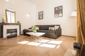 Deluxe Apartment, Courtyard View | Living area | 55-inch Smart TV with digital channels, Netflix, streaming services - Le Marais Elegance (Paris)