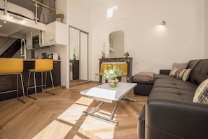 Deluxe Apartment, Courtyard View | Living area | 55-inch Smart TV with digital channels, Netflix, streaming services