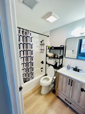 Shower, hair dryer, towels, soap