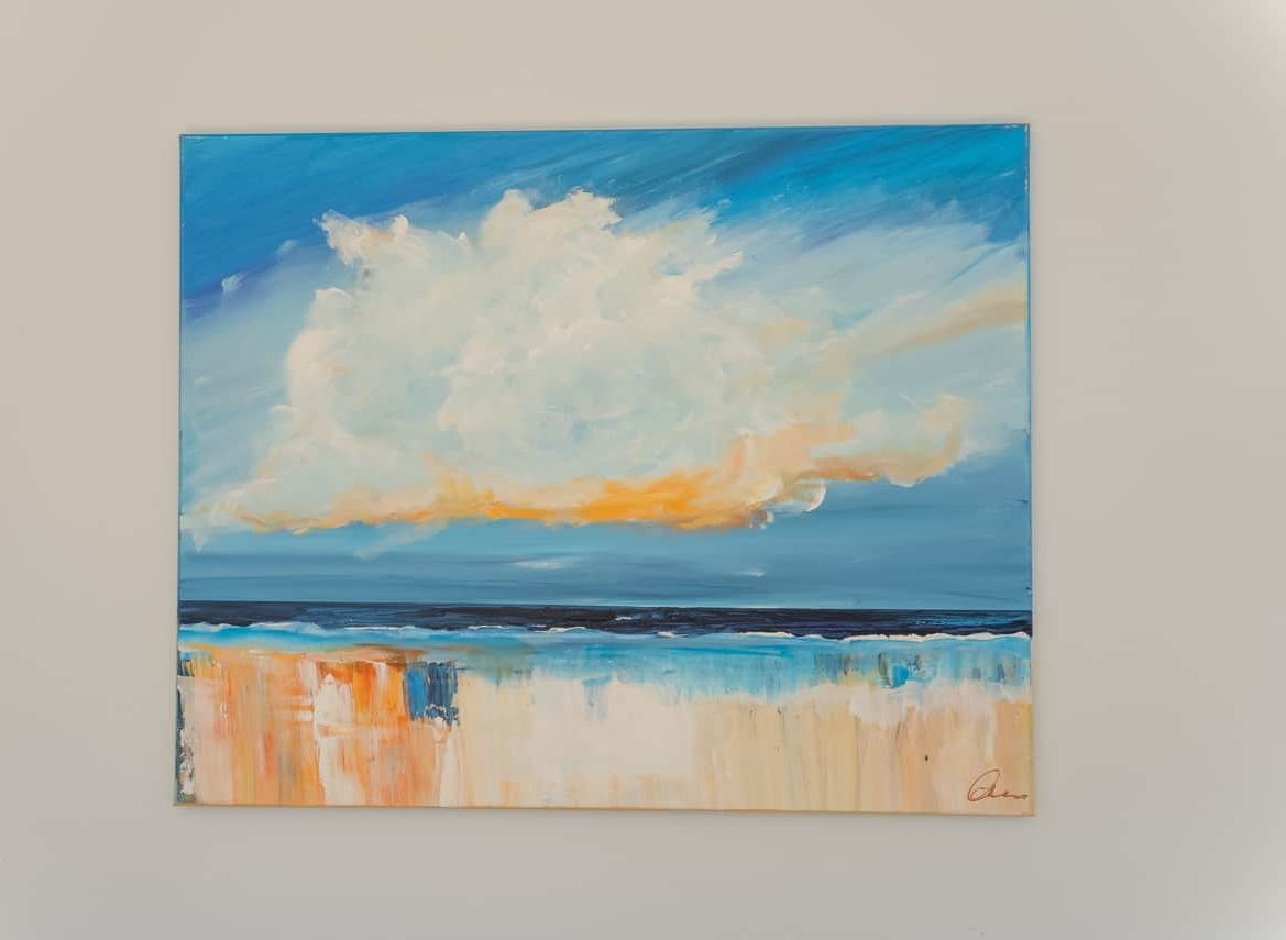 A painting of a beach scene with a large cloud and ocean waves.