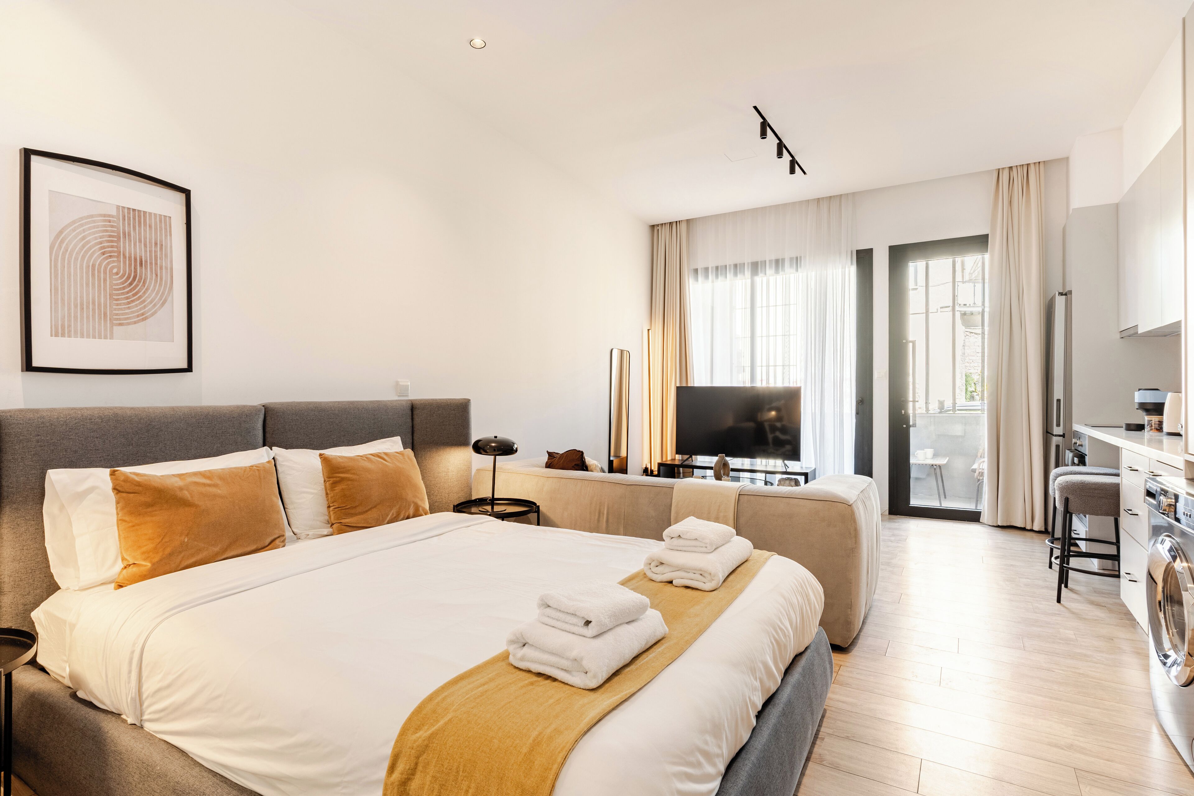 Deluxe Apartment, Non Smoking, Balcony | Desk, laptop workspace, blackout drapes, iron/ironing board