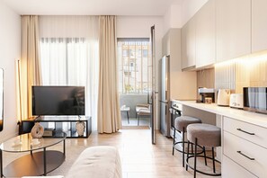 Deluxe Apartment, Non Smoking, Balcony | Desk, laptop workspace, blackout drapes, iron/ironing board