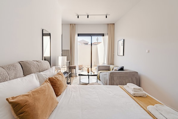 Deluxe Apartment, Non Smoking, Balcony | Desk, laptop workspace, blackout drapes, iron/ironing board