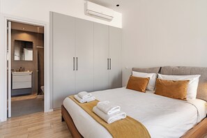 Deluxe Apartment, Non Smoking, Balcony | Desk, laptop workspace, blackout drapes, iron/ironing board