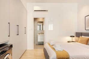 Deluxe Apartment, Non Smoking, Balcony | Desk, laptop workspace, blackout drapes, iron/ironing board