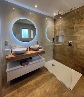 Shower, hair dryer, towels, toilet paper