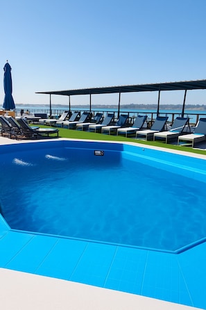 Outdoor pool, pool umbrellas, sun loungers