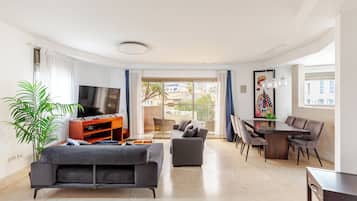 Deluxe Apartment, 2 Bedrooms, Sea View, Beachside | Living area | TV