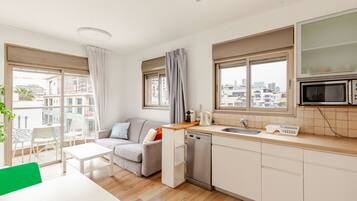 Deluxe Apartment, 1 Bedroom, Balcony, Beachside | Living area | TV