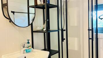 Shower, hair dryer, towels, soap