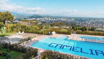 2 outdoor pools, open 9:00 AM to 10:00 PM, pool umbrellas, sun loungers