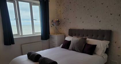 Charming Seafront Home at Martello Bay- 3 Bedroom house by Catchpole Stays