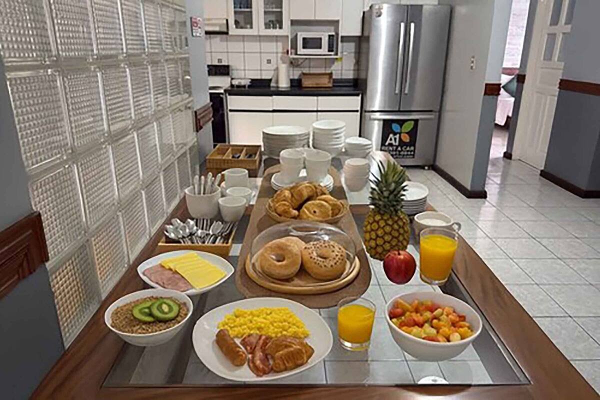 A breakfast buffet with various food items and beverages.