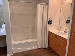 Jetted bath, hair dryer, towels, soap