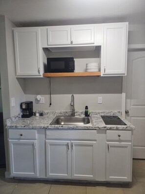 Microwave, stovetop, cookware/dishes/utensils