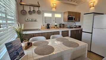 Fridge, microwave, stovetop, coffee/tea maker