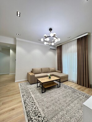 Departamento Confort, vista a la ciudad | Área de sala de estar