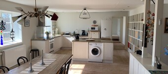 An apartment with generous space for socializing with family and friends.
