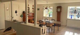 An apartment with generous space for socializing with family and friends.