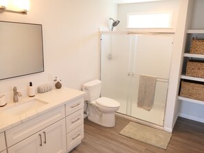 Shower, hair dryer, towels, soap