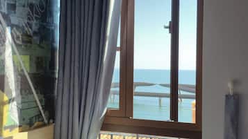 Family Quadruple Room, Beach View | Laptop workspace, blackout drapes, iron/ironing board, free WiFi