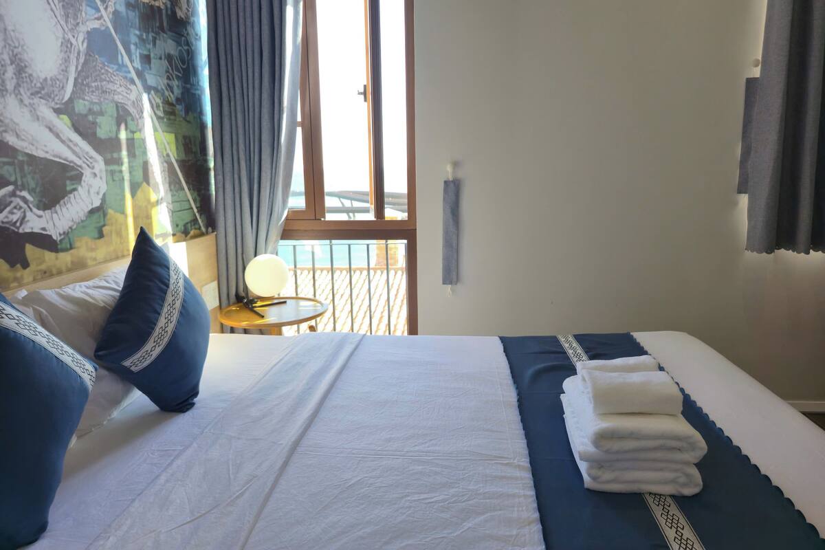 Family Quadruple Room, Beach View | Laptop workspace, blackout drapes, iron/ironing board (on request)