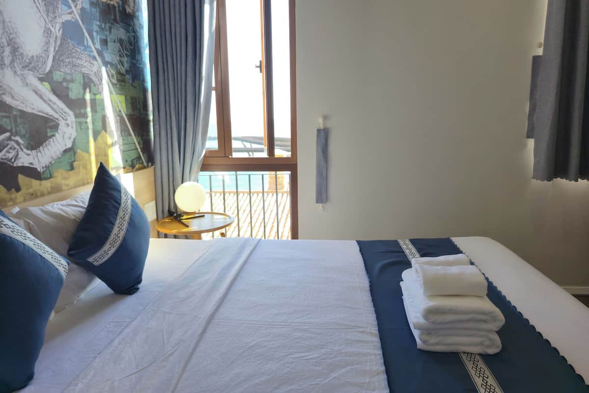 Family Quadruple Room, Beach View | Laptop workspace, blackout curtains, iron/ironing board, free WiFi