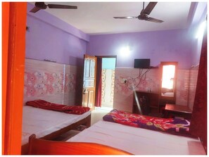 Deluxe Quadruple Room, Air conditioning | Hypo-allergenic bedding, in-room safe, desk, soundproofing