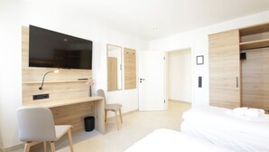 A modern hotel room with a wooden desk, a chair, a bed, and a wardrobe. - 3-2-1meins Müngsten Bridge (Remscheid)