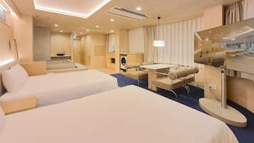 Deluxe Studio, 2 Queen Beds, Kitchenette, City View | Premium bedding, desk, blackout drapes, iron/ironing board