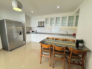 Fridge, microwave, electric kettle, cookware/dishes/utensils