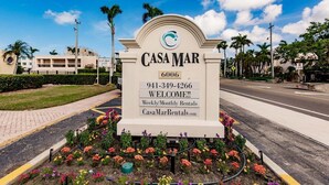 A sign for Casa Mar with contact information and a welcome message. - Casa Mar - 58 Premium Plus (Sarasota)