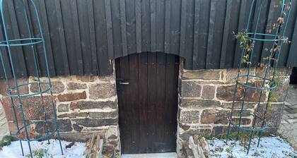 Historic signal box of the Erzgebirge Railway with garden for a romantic vacation.