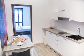 Appartement Deluxe, balcon | Coin séjour