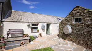 A stone house with a white exterior and a tiled roof. - Boloquoy Victorian Farm & Watermill.  Authentic period immersive experience (Orkney)