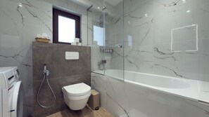 Shower, hair dryer, towels, soap