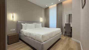 2 dormitorios, caja fuerte, tabla de planchar con plancha