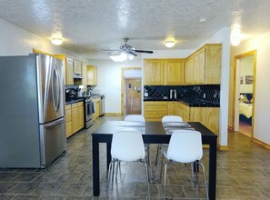 Dining - Clean, fully stocked home in Mitchell. (Mitchell)