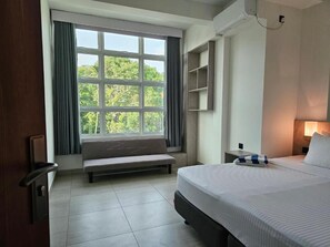 Deluxe Double or Twin Room, Garden View | In-room safe, desk, laptop workspace, blackout drapes