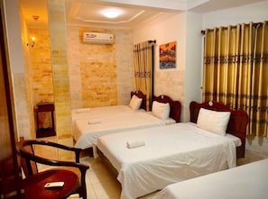 Quadruple Room, Multiple Beds | Minibar, desk, free WiFi, bed sheets
