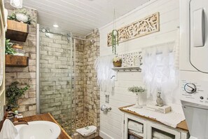 Shower, hair dryer, towels, soap
