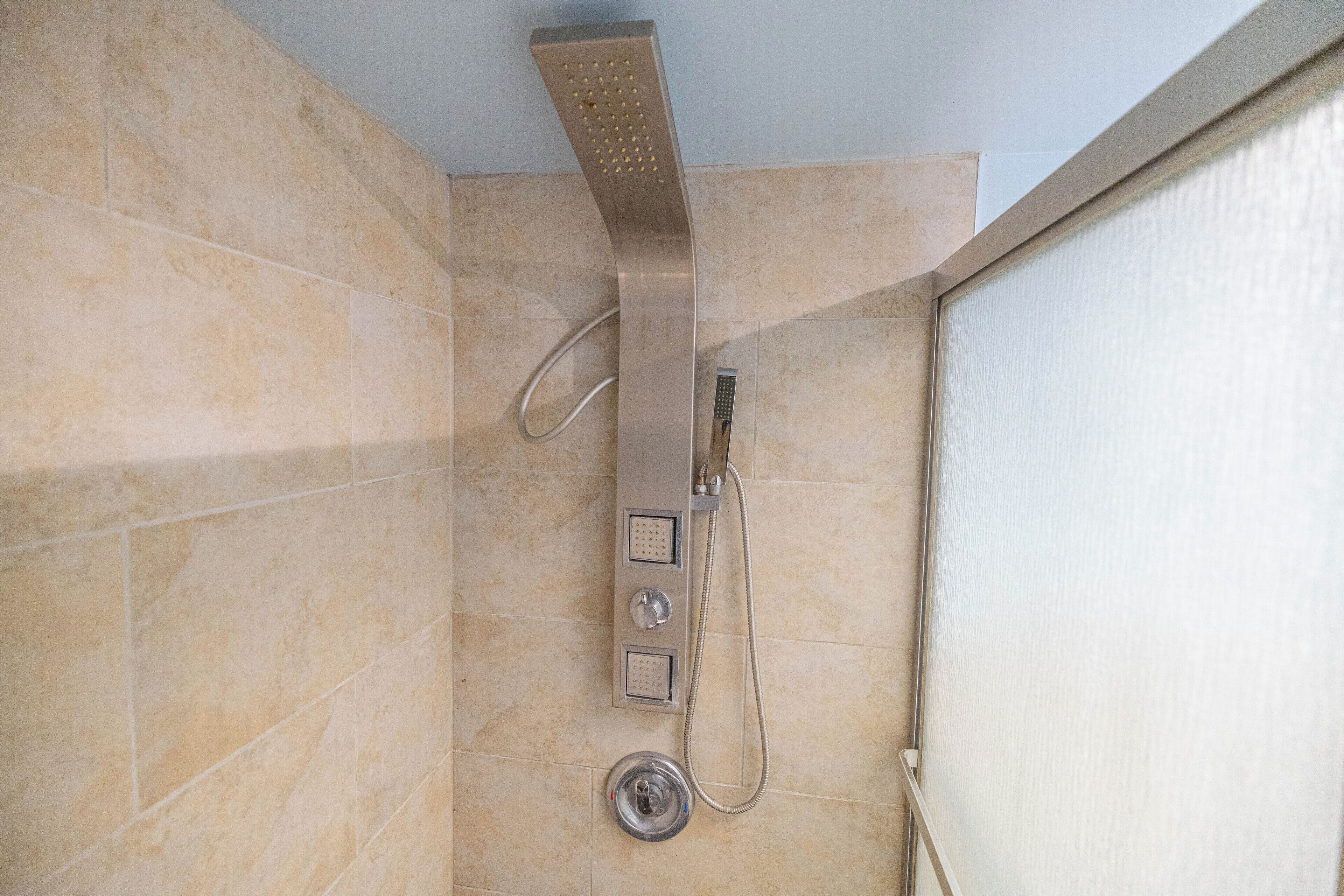 Shower, hair dryer, towels, toilet paper
