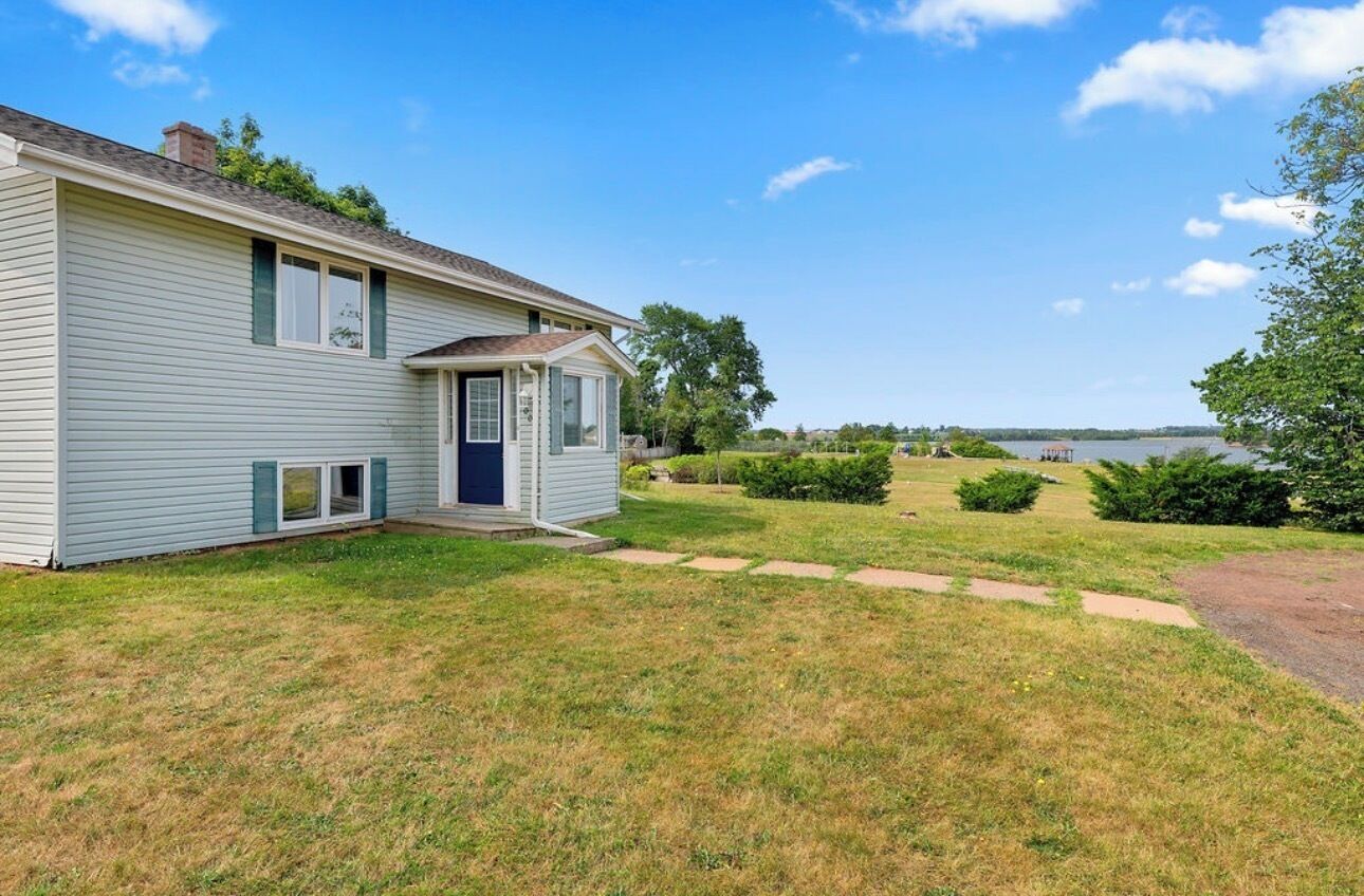 A single-story house with a small attached garage, a front porch, and a well-maintained lawn.