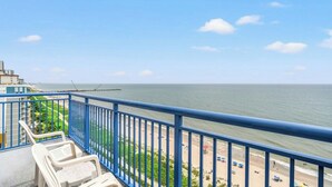 A balcony with a view of the sea and a beach. - Atlantica III PH64- Oceanfront 1BR- Lazy River (Myrtle Beach)