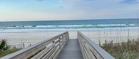 On the beach, sun-loungers