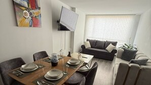 A modern living room with a dining area. - Apartment for 8 guests in the center of Pasto 3 bedrooms 2 bathrooms (Pasto)