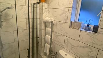 Shower, hair dryer, towels, soap